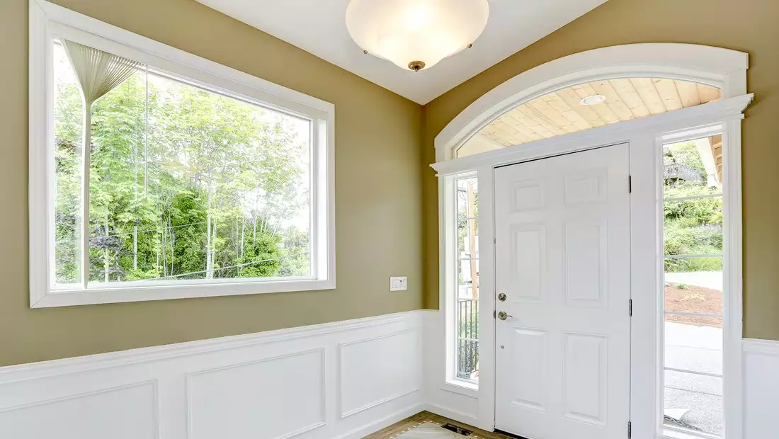 House Interior Entrance featuring Window and Front Door Trim
