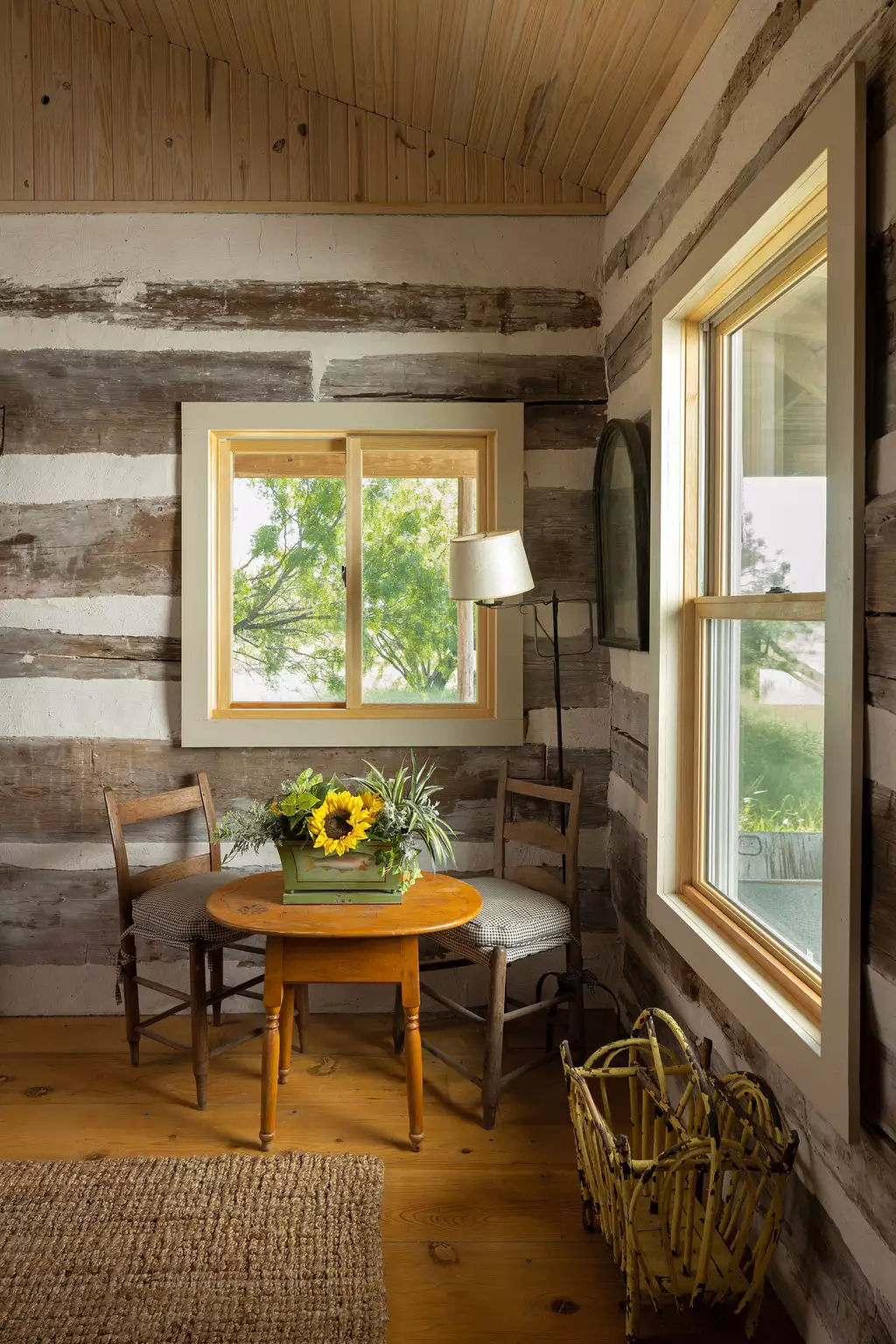 log cabin corner windows with flowers