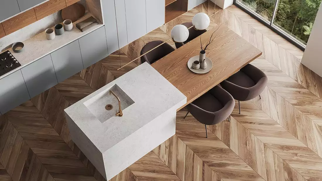 Overview of Kitchen Island with Stone Bar/Sink and Wood Table/Chairs