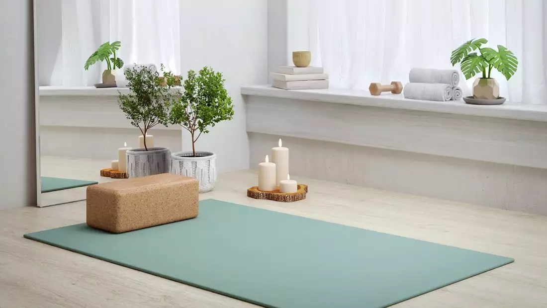 Room with Yoga Mat, Mirror, Candles, Plants, Towels and Hand Weights